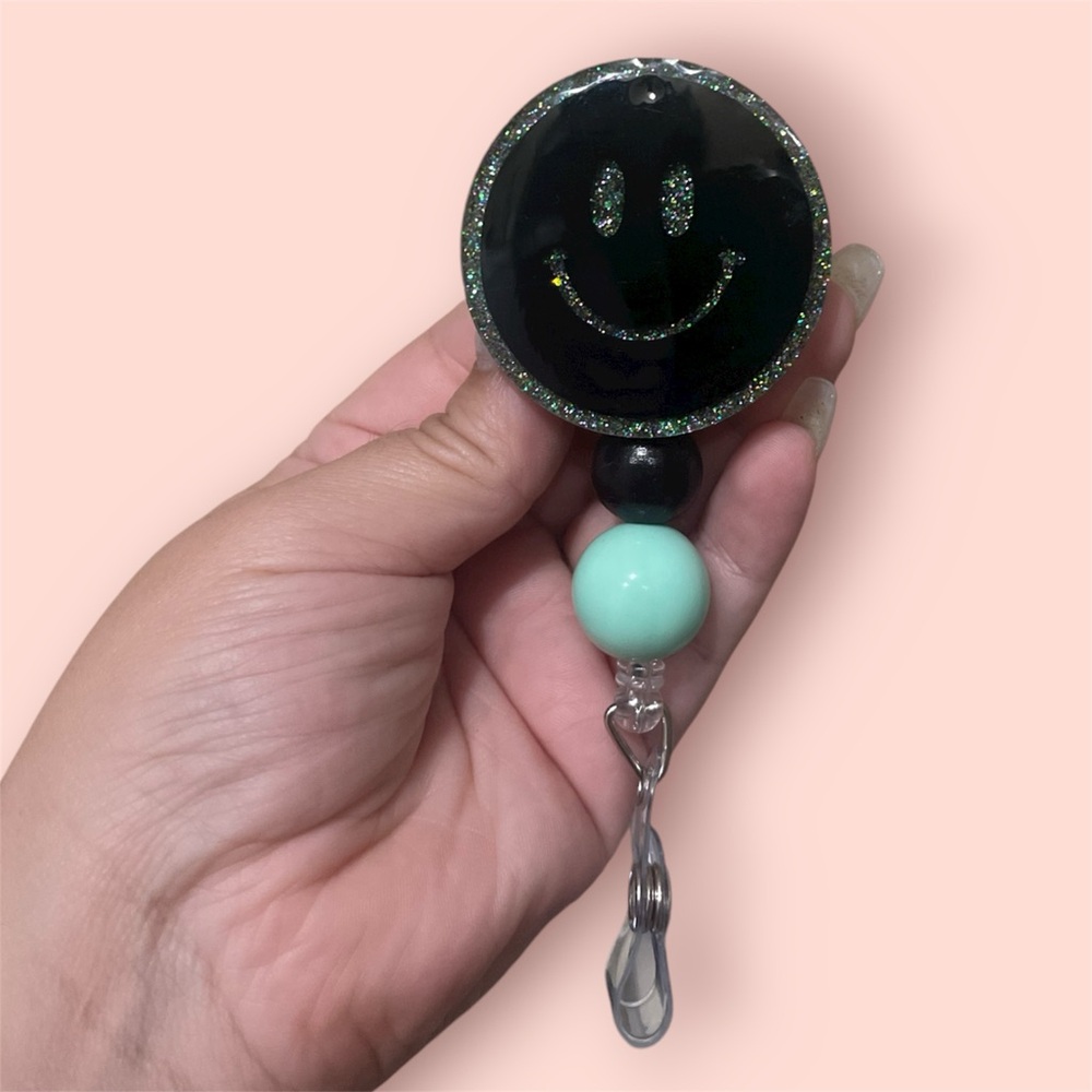 Black and Mint Smiley Faca badge reel